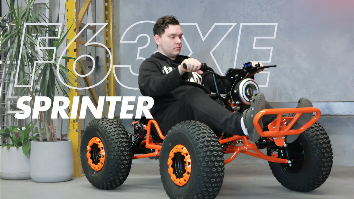 Man Sitting on the F63XE Orange Electric Go Kart 