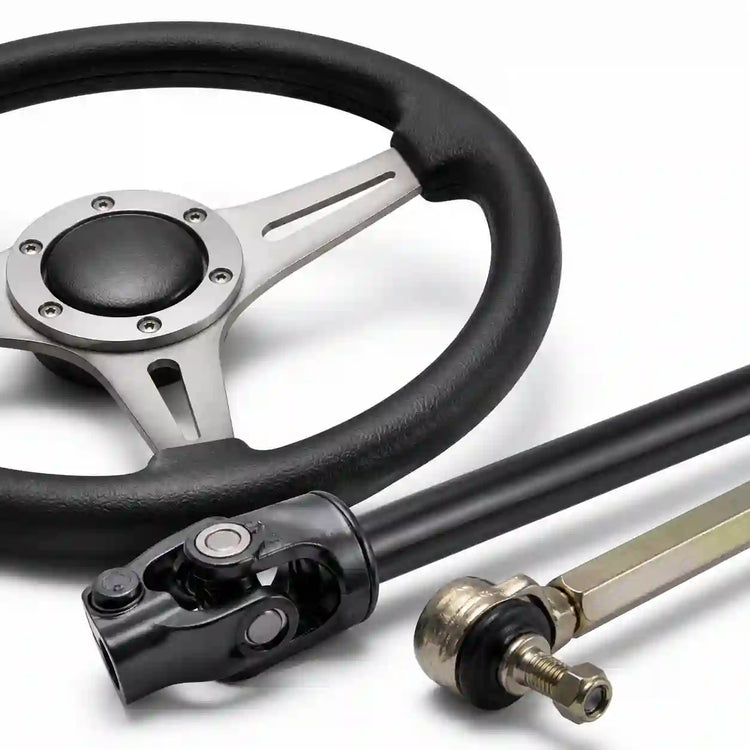 Steering wheel, steering shaft and tie rod parts on a clean white background.